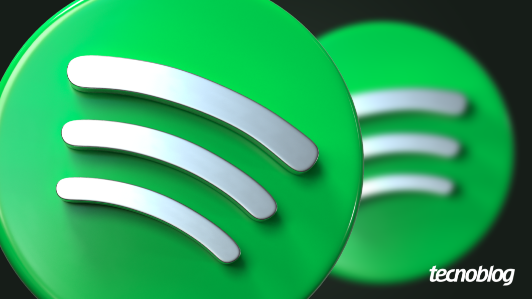 Dois logos do Spotify em close-up sobre um fundo escuro. Cada logo é um círculo verde vibrante com três barras horizontais curvas e brancas em seu interior, representando ondas sonoras. Na parte inferior direita, está o logotipo do "Tecnoblog".
