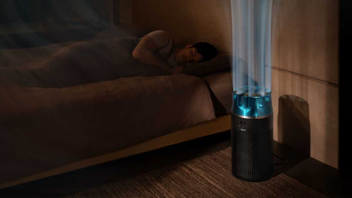 The purifier next to a bed