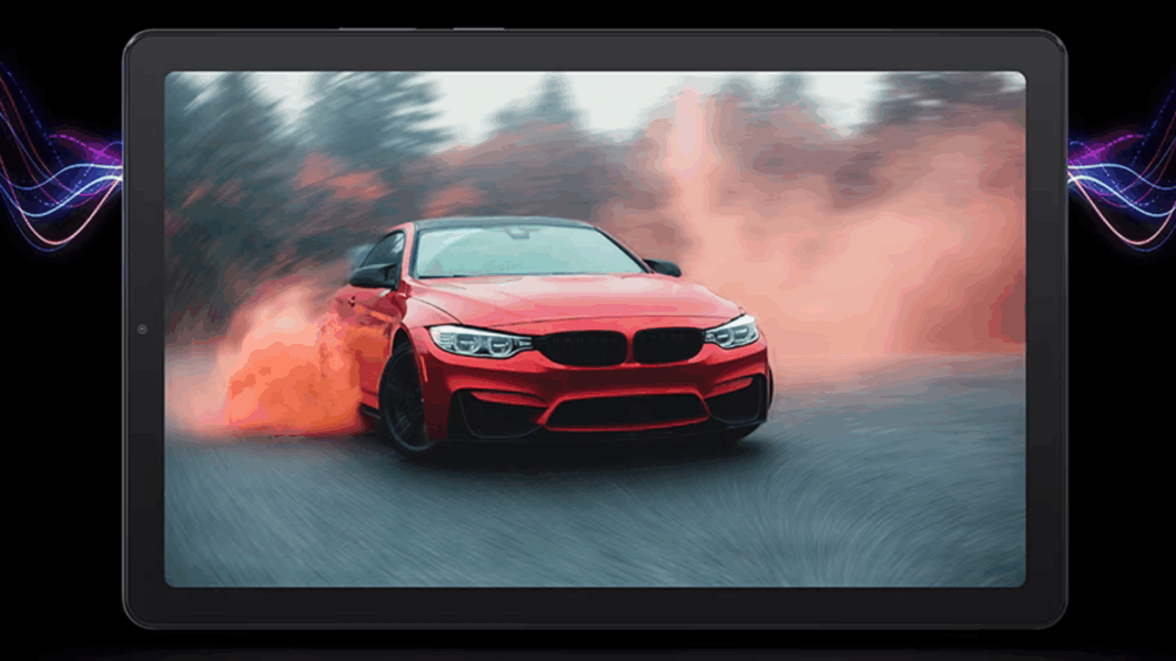 Tablet lenovo M9 na horizontal com uma imagem de um carro vermelho acelerando