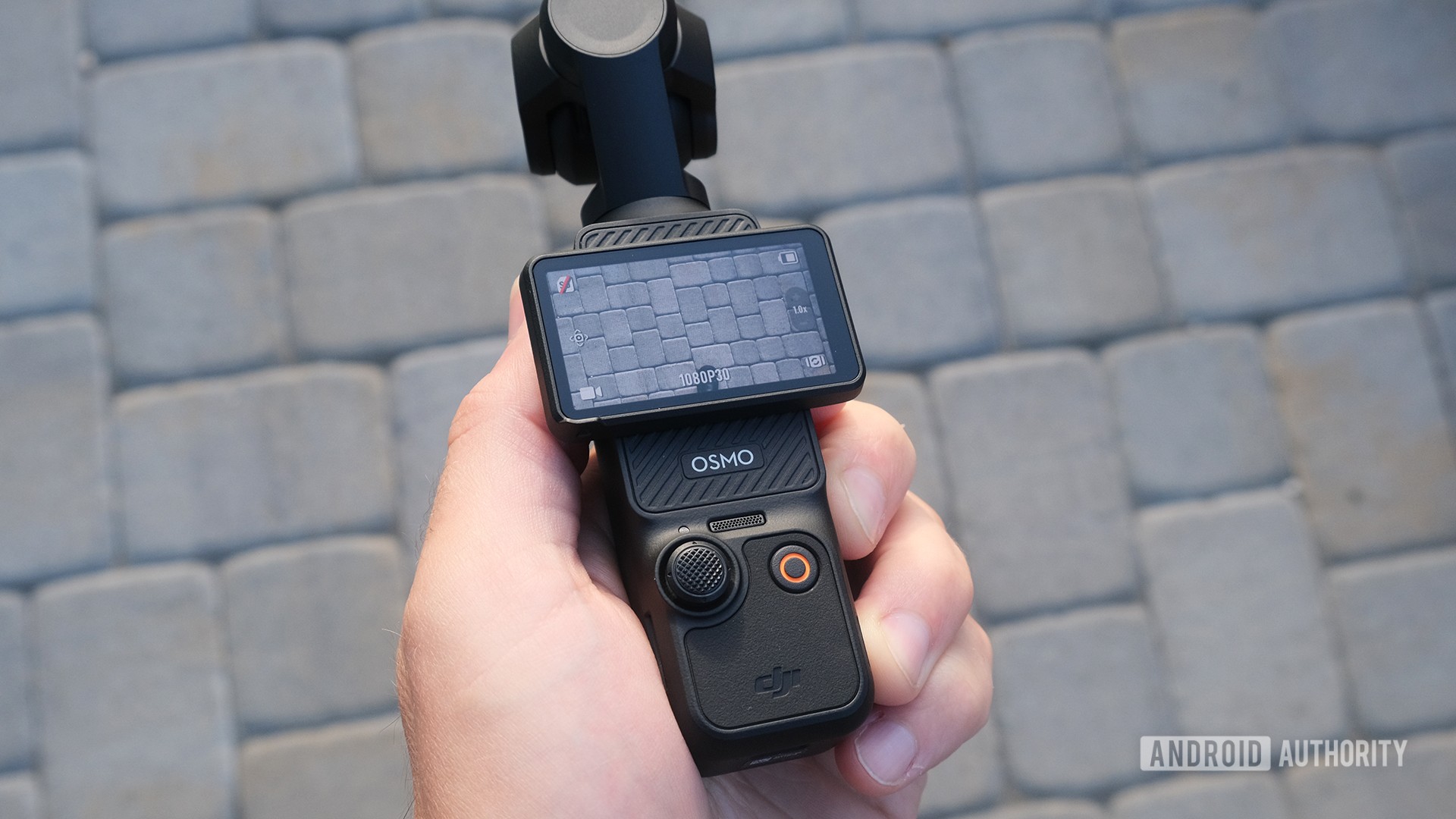 DJI Osmo Pocket 3 frontal com display e controles de paisagem DJI Osmo Pocket 3 frontal com display e controles de paisagem