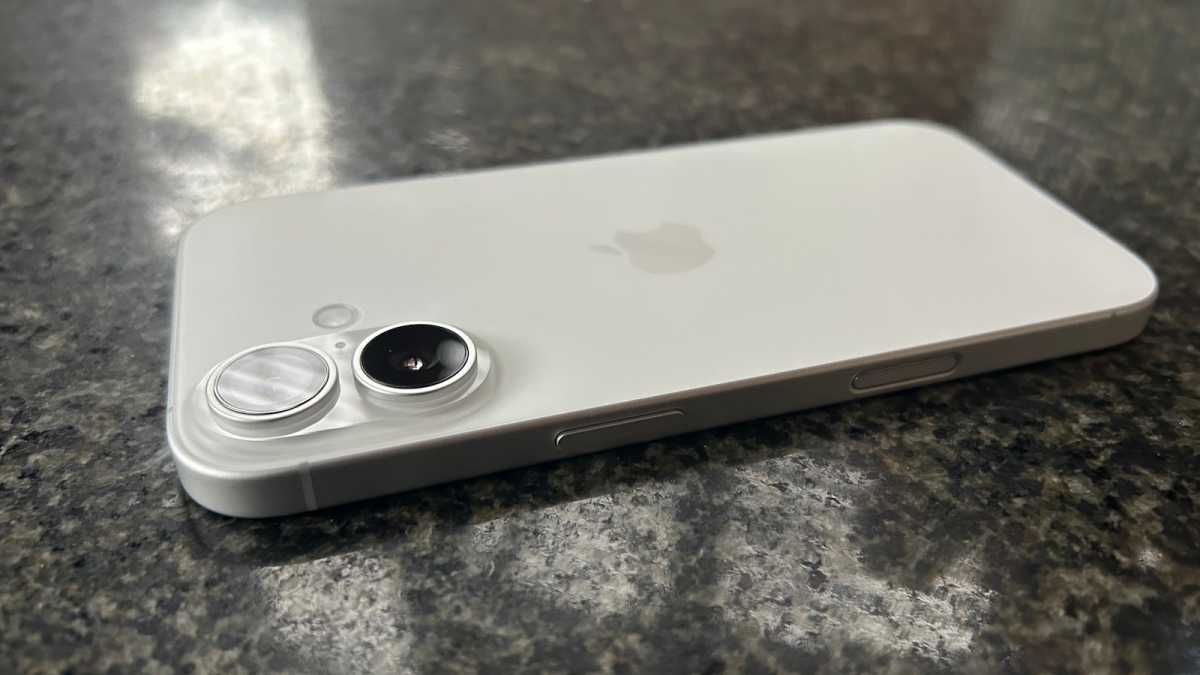 White iPhone 17 on a granite surface