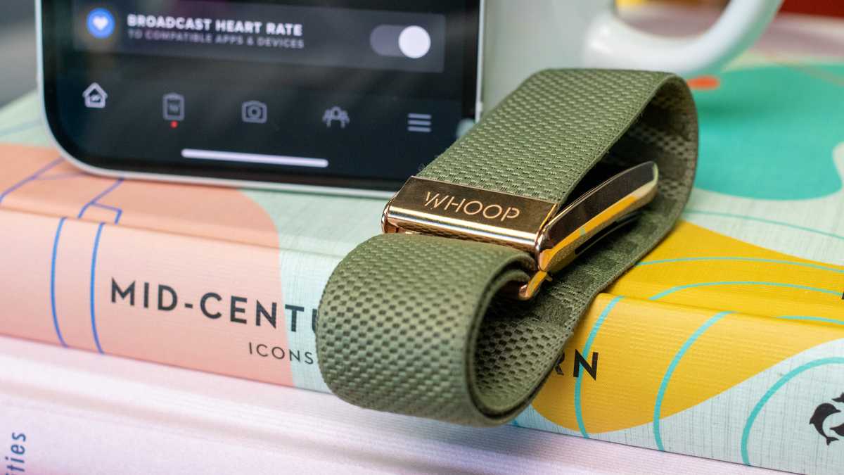 A Whoop 4.0 band on a book